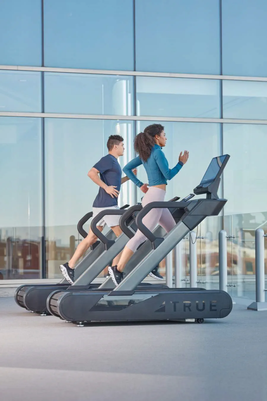 2 people running on treadmill